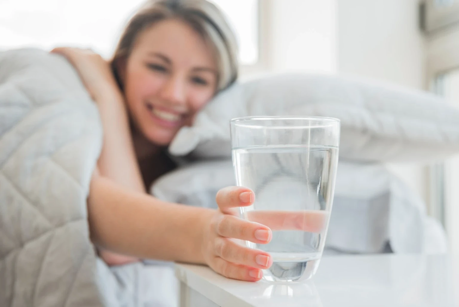 blonde_girl_taking_glass_of_water_23_2148113536-_1_